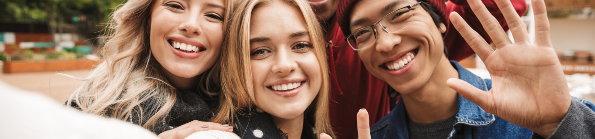 Group if cheerful multiethnic friends teenagers